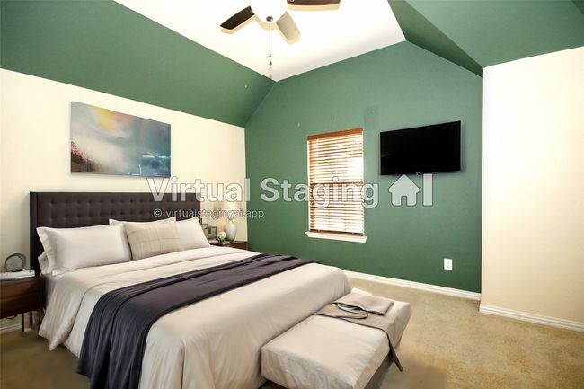 Virtual -Carpeted bedroom with baseboards, vaulted ceiling, and a ceiling fan | Image 31