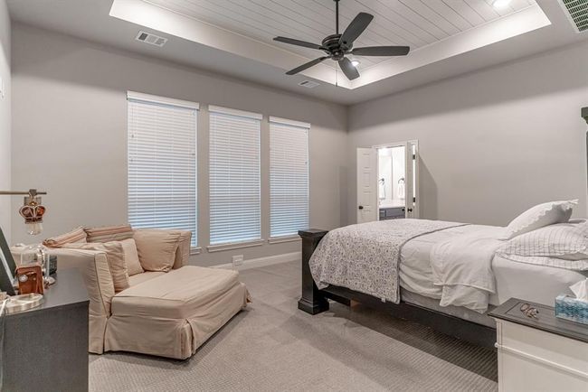 Office space with beamed ceiling, ceiling fan, light hardwood / wood-style floors, and a wealth of natural light | Image 18