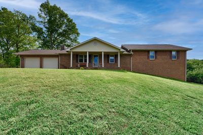 Front of house - covered front porch, two-car attached garage | Image 2