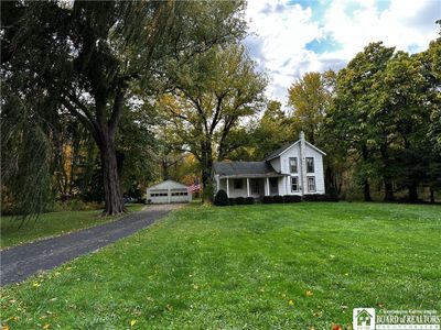 Exterior view of the home and garage | Image 2