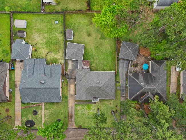 Enjoy one of the larger lots available with extra long driveway and private gate entrance to the left. | Image 25
