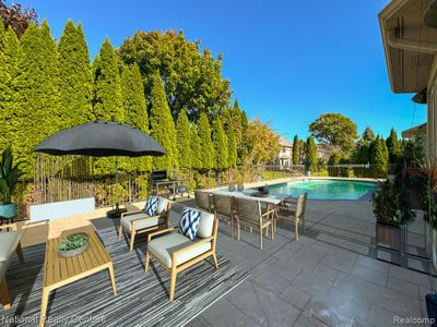 Poolside Virtually staged outdoor patio furniture. | Image 3