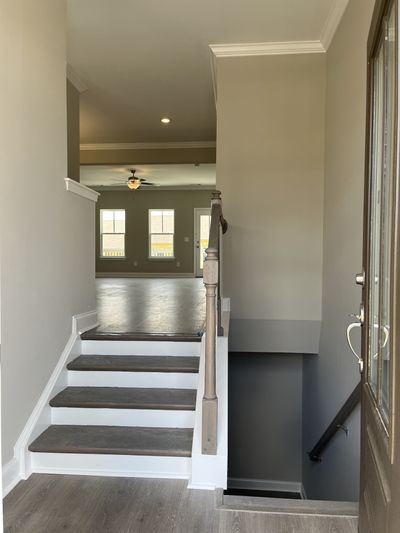 Entrance level. Downstairs to garage/basement level. Step up to main floor Great room and Kitchen. Not actual home. | Image 3