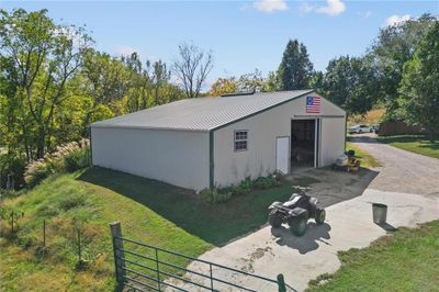 View of outbuilding featuring a lawn | Image 2