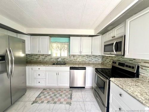 1047-4169 70th Ln N, West Palm Beach, FL, 33404-4819 | Card Image