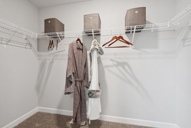 Photo is of the actual model. The primary bedroom features an incredible walk-in closet | Image 13