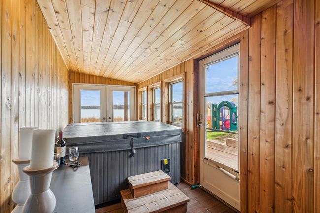Lower level sun room with walk-out access to the patio | Image 31