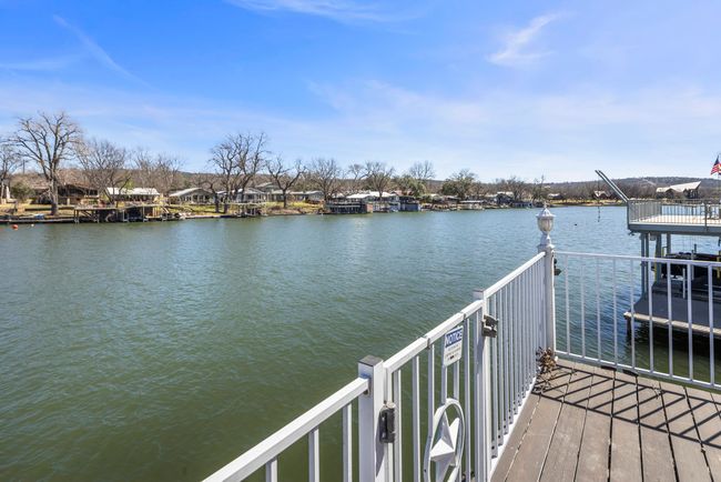 View of dock featuring a balcony and a water view | Image 26