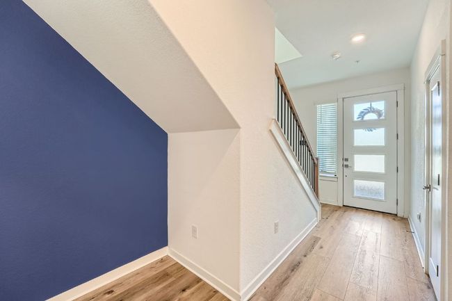 Foyer entrance featuring a wealth of natural light, baseboards, and hardwood / wood-style floors | Image 5