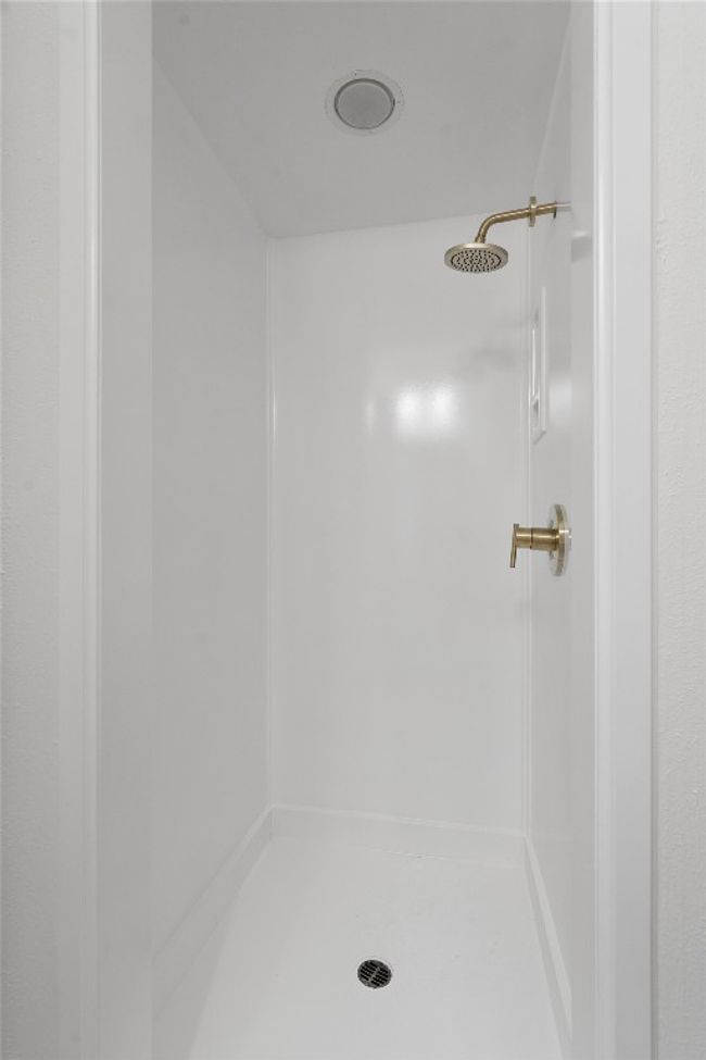 Bathroom with a shower stall | Image 16