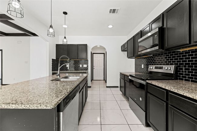 Oversized walk-in pantry near garage entrance | Image 10