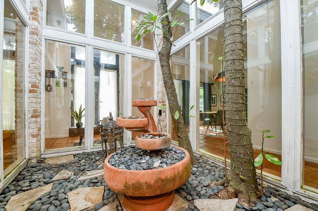 Enjoy nature, as crafted from inside the atrium, as well as from outside windowed walls. | Image 7