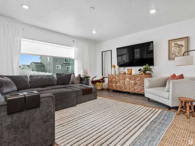 Living area featuring wood finished floors and recessed lighting | Image 22
