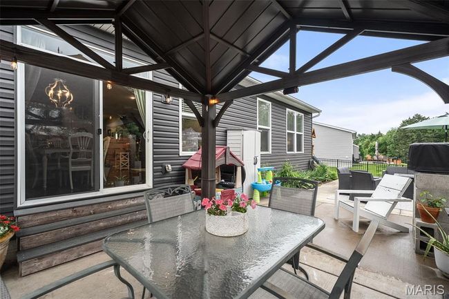 View of patio with outdoor dining area | Image 41