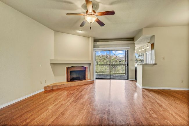 Living room with sliding glass door to back deck - Tons of natural light floods the space | Image 9