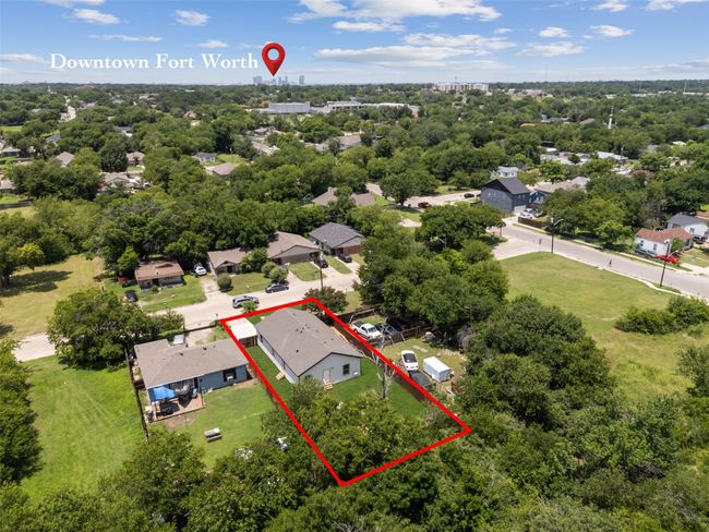 Aerial perspective of suburban area with property boundaries highlighted and a tree filled landscape | Image 34