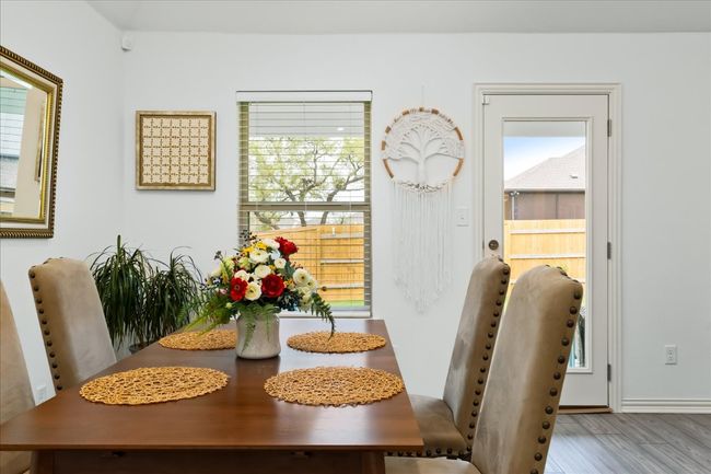 Dining space with wood finished floors | Image 14