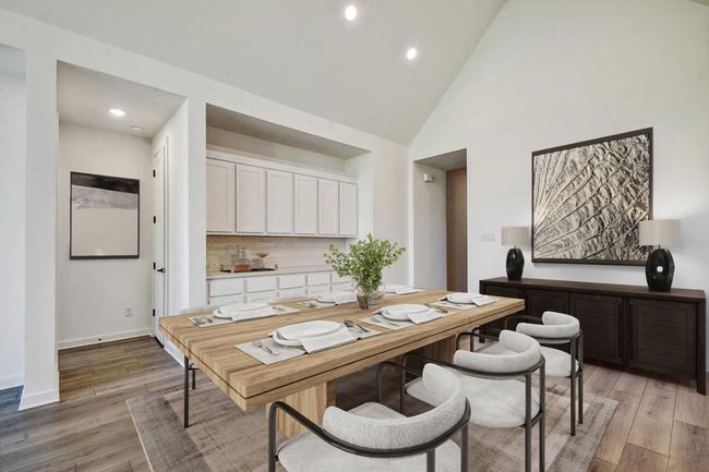 Office with light wood finished floors, recessed lighting, and high vaulted ceiling | Image 4