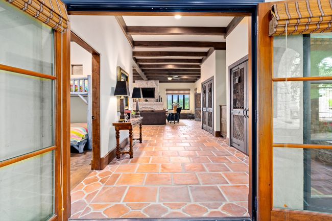 Upper clubroom with kitchenette, murphy beds, girls bunk room, 2 full baths and spectacular lake views | Image 28