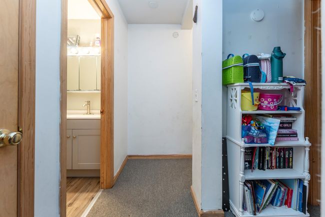 Hall with baseboards and a sink | Image 33