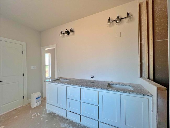 Primary bath with dual sink vanity, soaking tub with separate shower and two walk-in closets | Image 10