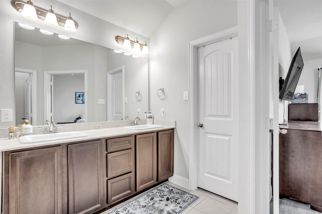 Full bathroom with tile patterned floors, double vanity, and connected bathroom | Image 16