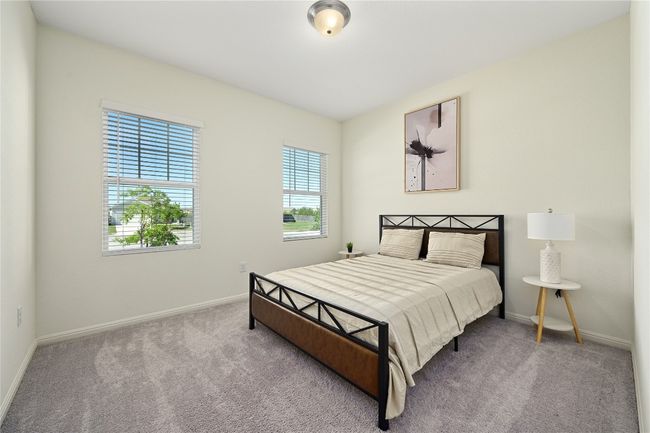 Bedroom with carpet floors and baseboards | Image 30