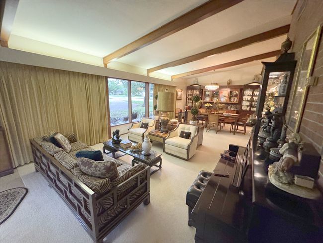 Living area with carpet and beam ceiling | Image 22