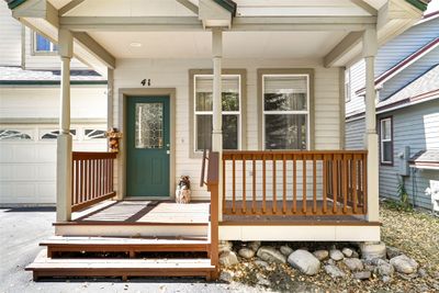 View of exterior entry with covered porch and a garage | Image 3