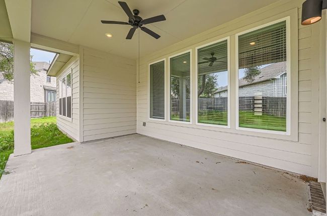 View of patio / terrace with ceiling fan and fence | Image 27