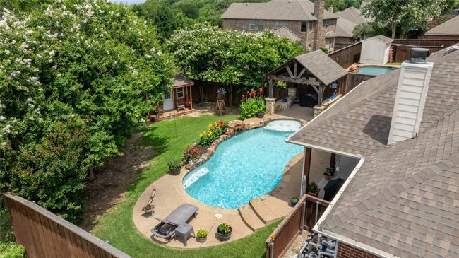 View of swimming pool featuring a patio and a gazebo | Image 27