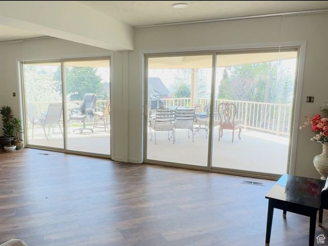 Living room out to upper covered deck | Image 7