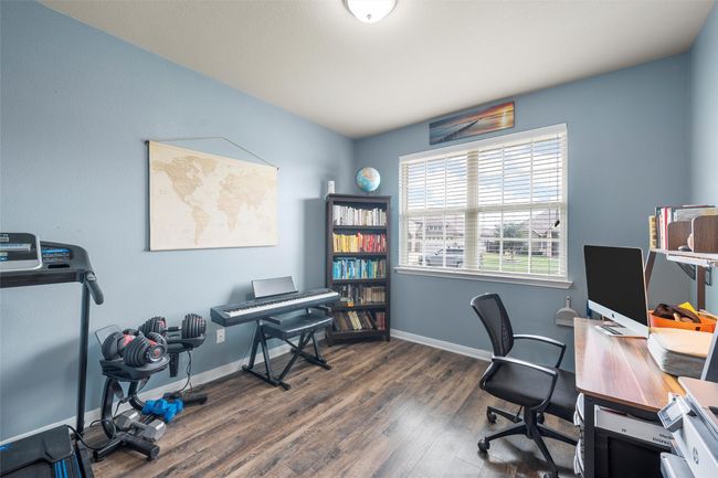 Home office with wood finished floors and baseboards | Image 11