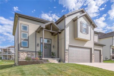 ARCHITECTURAL WINDOWS AT THE ENTRY DOOR AND FRONT OF HOME ARE VERY APPEALING | Image 1