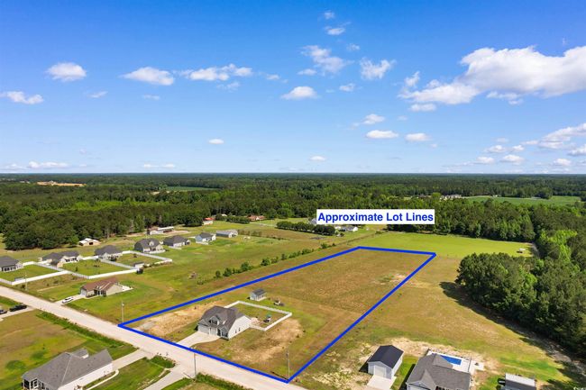 Aerial view of residential area featuring property parcel outlined | Image 36