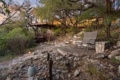 Terraced steps lead from the deck to the lawn | Image 3