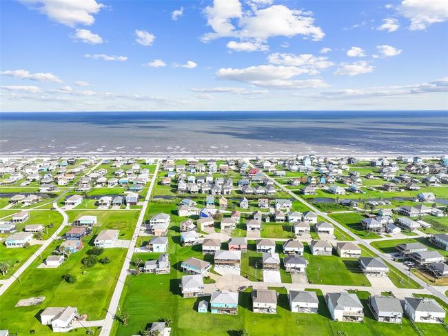 Located just 6 blocks from the beach, this home offers a peaceful cul-de-sac setting with wide open views, plenty of space to spread out, and a quick and easy golf cart ride or bike to the sandy shores of Crystal Beach. | Image 32