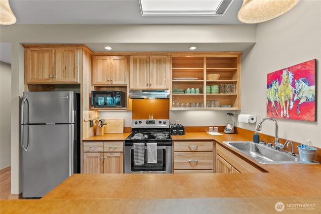 Natural light streams in from the skylight above. | Image 26