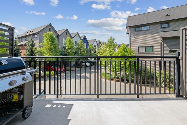 View of patio / terrace featuring a balcony, a residential view, and grilling area | Image 38