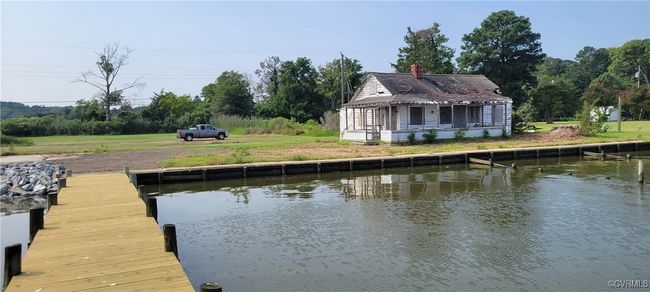 Dock area featuring a water view and a lawn | Image 19