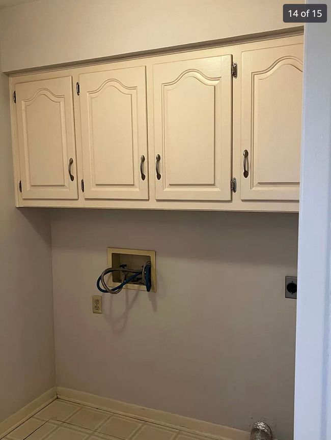 Laundry room featuring cabinet space, washer hookup, and electric dryer hookup | Image 10