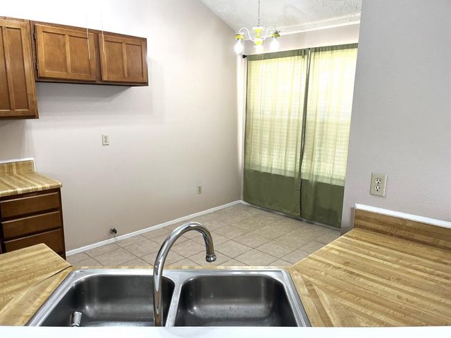 View of the kitchen from the breakfast bar... | Image 9
