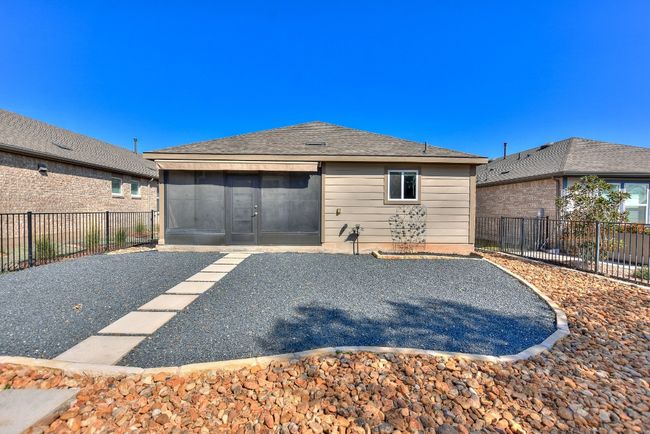 Retractable sun shade on back of home. | Image 32