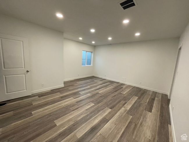 Unfurnished room with dark wood-type flooring | Image 21