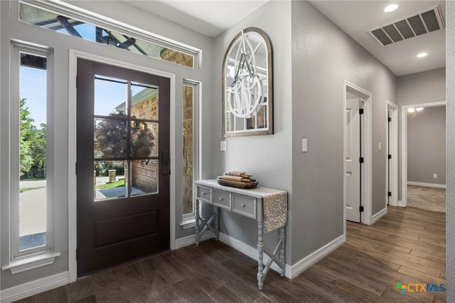 Entryway and Laundry Room Door and then Door to Access the Bonus Room Above the Garage | Image 4