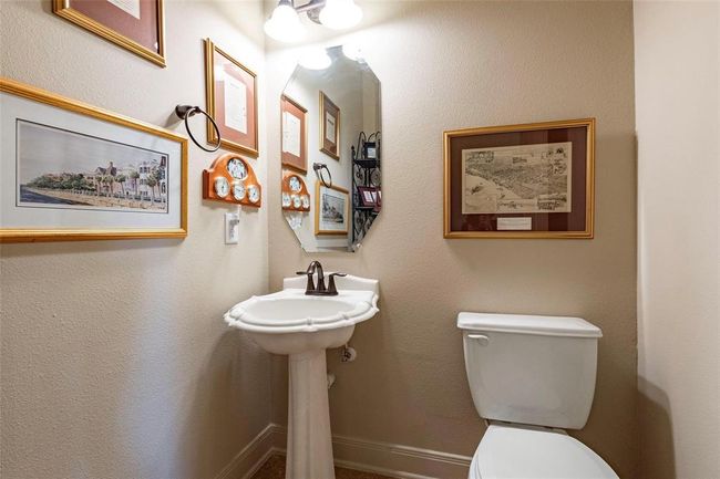 Half bath is located near the front study/bedroom. | Image 21