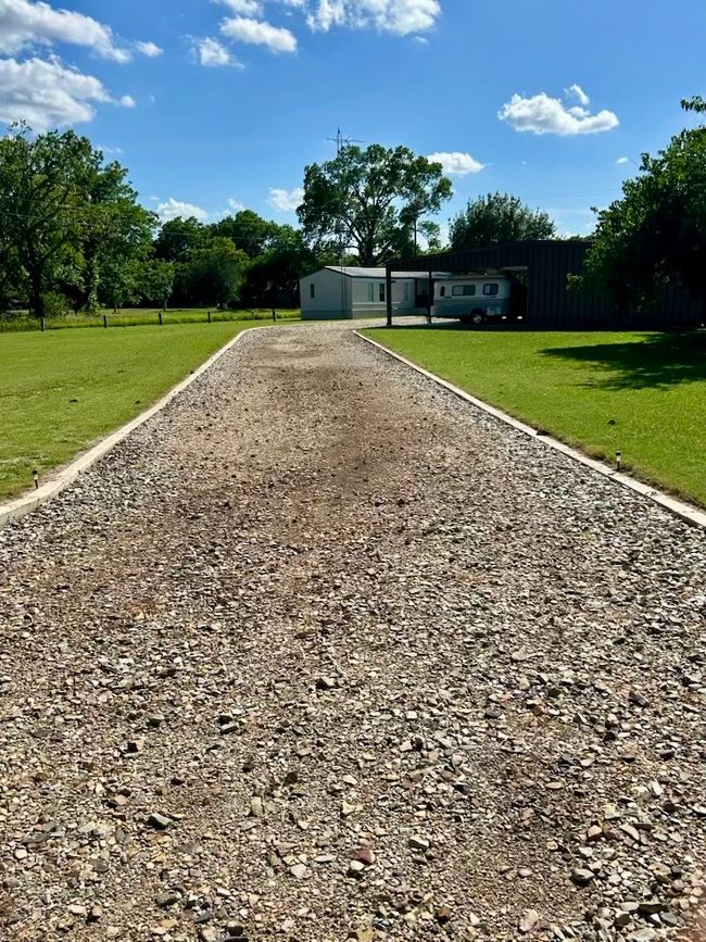 View of front of property with driveway and a front yard | Image 5