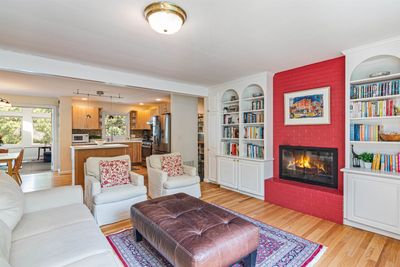 Offering built-ins and a wood-burning fireplace. | Image 3