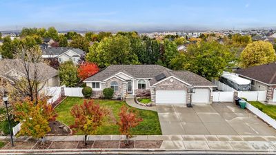 View of front facade featuring a front yard and a garage | Image 2