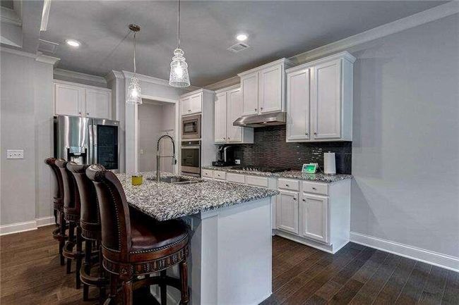 7059 Lancaster Xing, House other with 4 bedrooms, 3 bathrooms and 3 parking in Flowery Branch GA | Image 12